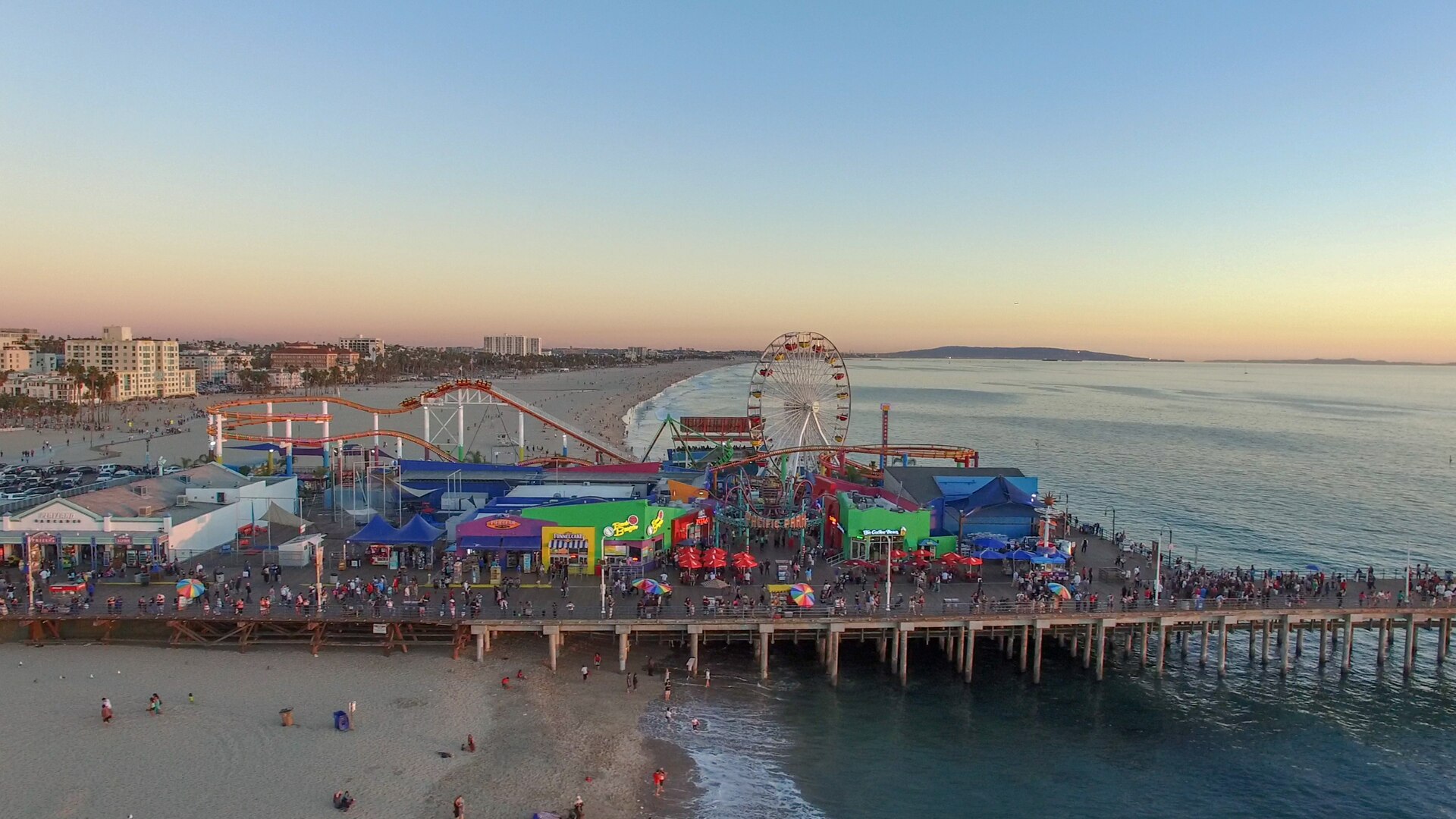 Santa Monica Pier, beach, and coastline at sunset